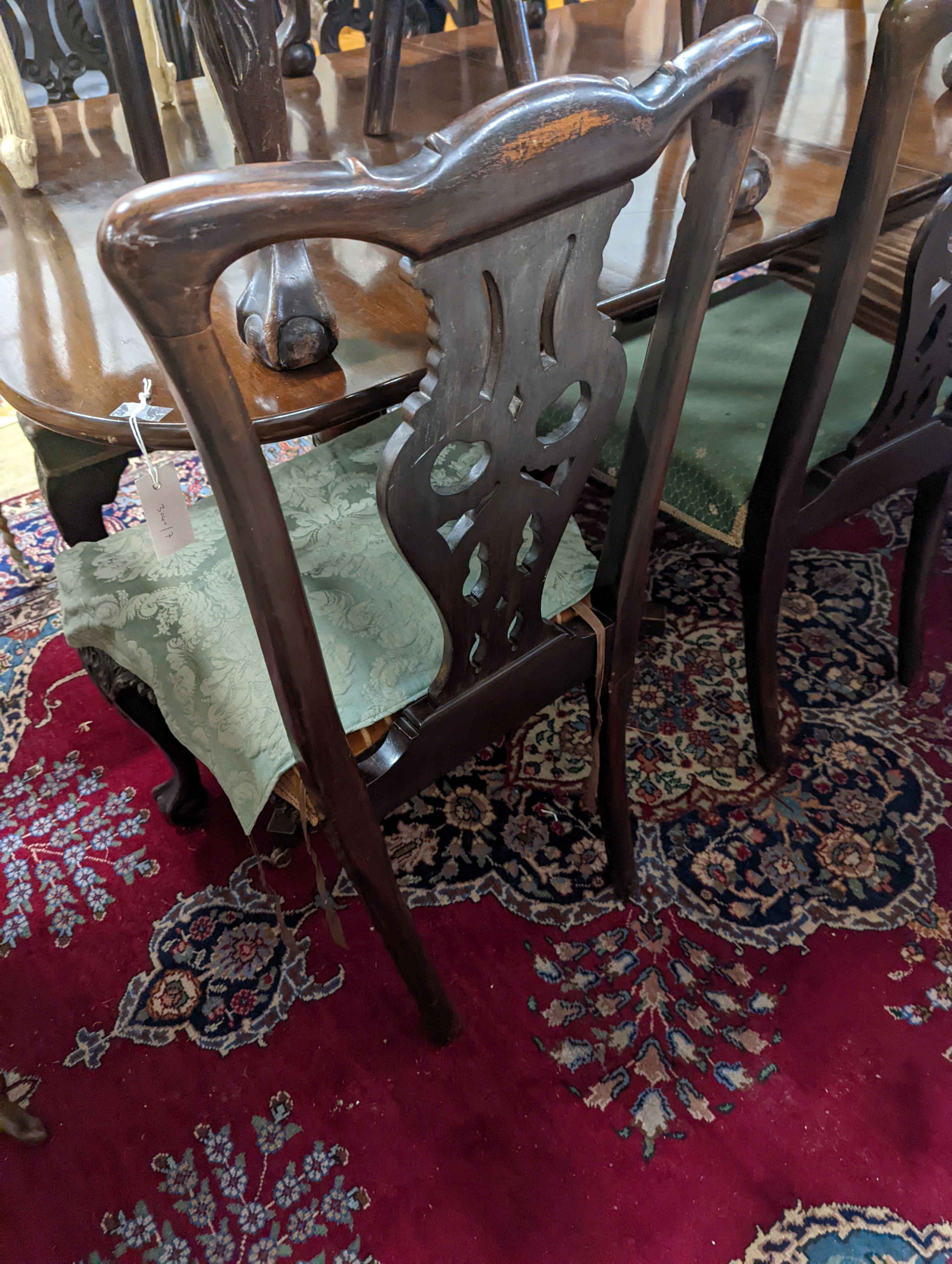 A set of twelve early 20th century Chippendale revival carved mahogany dining chairs including two carvers, width 56cm, height 95cm